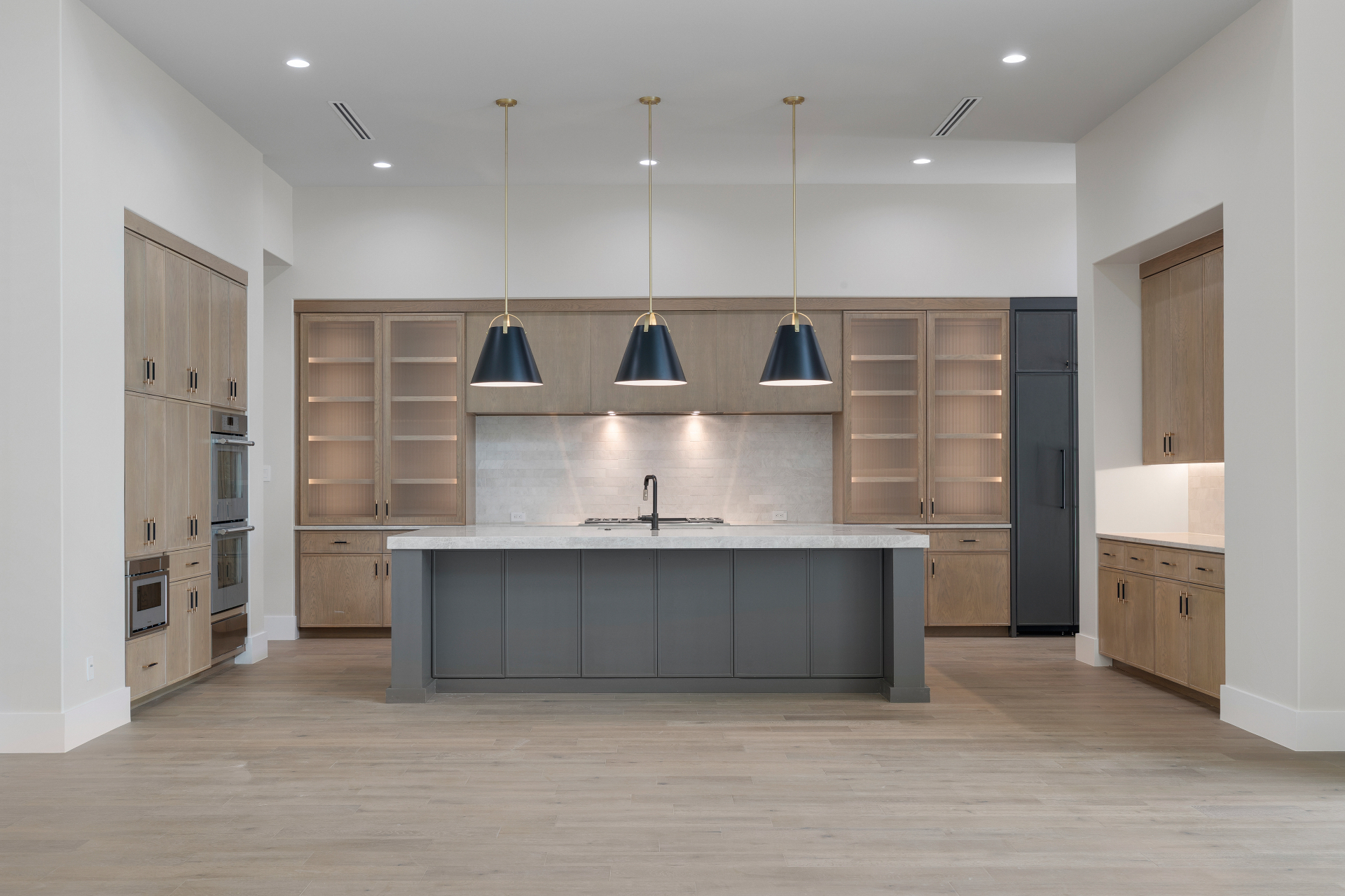 Custom cabinetry elevation drawings and material selections laid out for client approval.