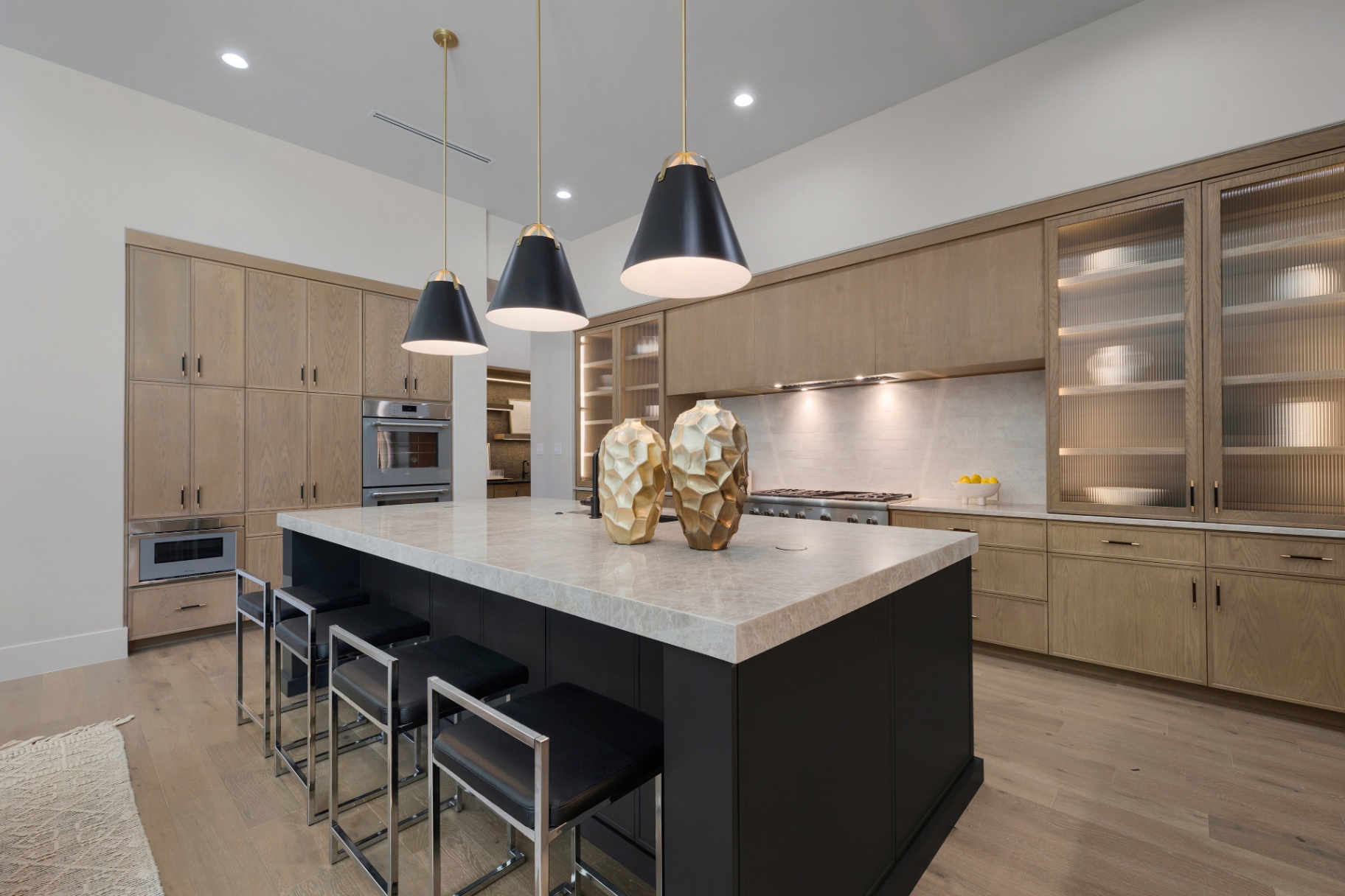 Graphite island with quartzite and brass vessels in The Dominion by Amaya